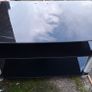 Black glass TV stand with silver legs Image 2