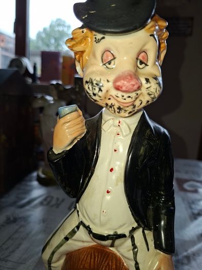 1950s to 70s Working Musical Decanter Hobo Clown Sitting on a Barrel. The base plays the tune Show Me the Way to Go Home, reminded me of the song from Jaws