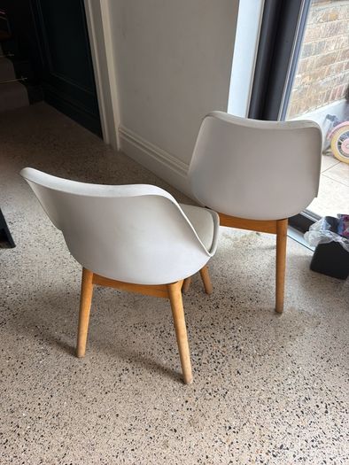 Two white bucket chairs
