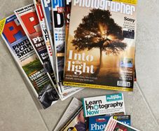 Selection of photography magazines and discs