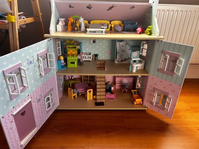 Wooden dolls house with accessories