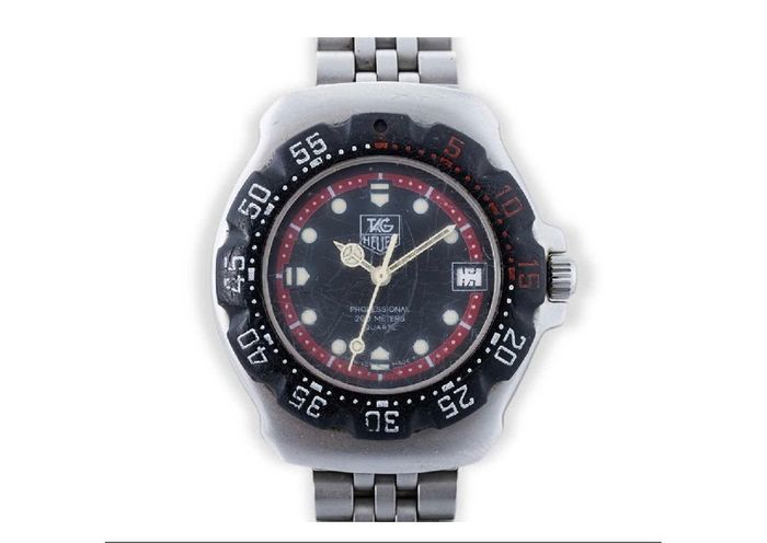 TAG HEUER WRIST WATCH, black dial with date, stainless steel bracelet strap, case ca. 34 mm