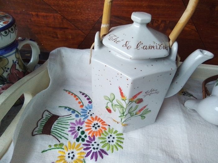 Two Wicker Handled Teapots
