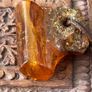 Raw Amber on leather Image 4