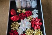Christmas bows and several rolls of ribbon