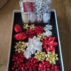 Christmas bows and several rolls of ribbon