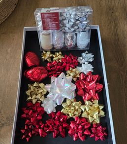 Christmas bows and several rolls of ribbon