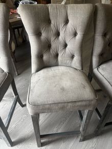 Three grey barstools