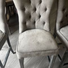 Three grey barstools