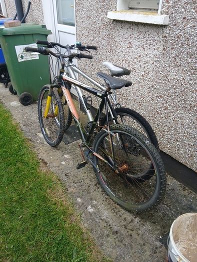 2 bikes silver one medium black one large