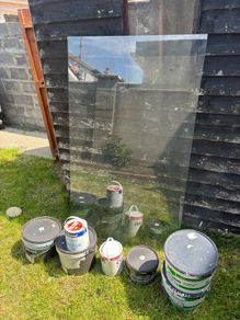 Large Pane of glass and various tins of paint