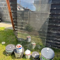 Large Pane of glass and various tins of paint