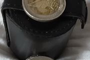 four white metal shot cup's in leather case
