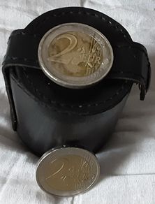 four white metal shot cup's in leather case