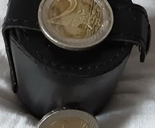 four white metal shot cup's in leather case
