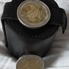 four white metal shot cup's in leather case
