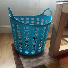 Blue plastic laundry basket