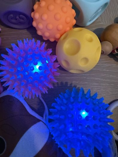 Selection of baby toys, sensory balls,