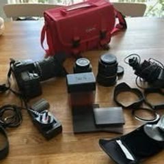 Nikon D80 with Sigma 18-200mm, Nikon 35mm, Tamron 10-24mm and filters and flashlight