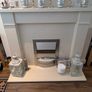 fireplace surround with an electric fan heater Image 3