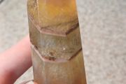 Yellow fluorite towerbwith mud inclusions