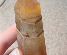 Yellow fluorite towerbwith mud inclusions