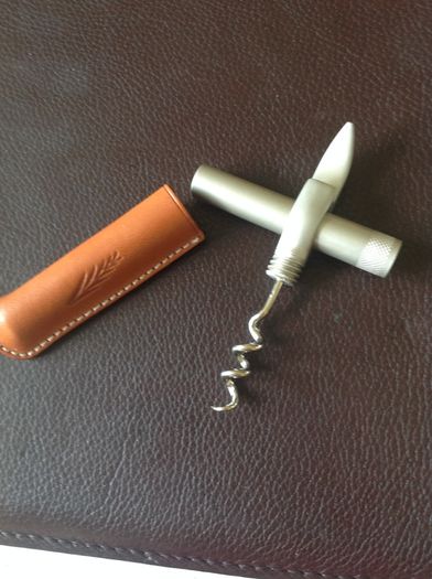 Corkscrew/ Bottle opener in Leather case.