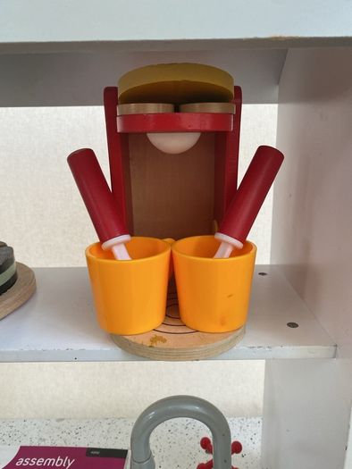 kids play kitchen by Plum with wooden food accessories