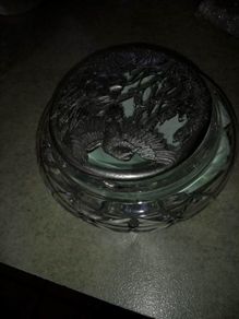 Cut glass crystal trinket dish with carved pewter lid.
