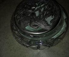 Cut glass crystal trinket dish with carved pewter lid.