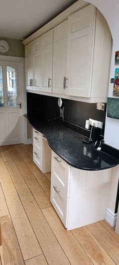 kitchen cabinets and black marble countertop