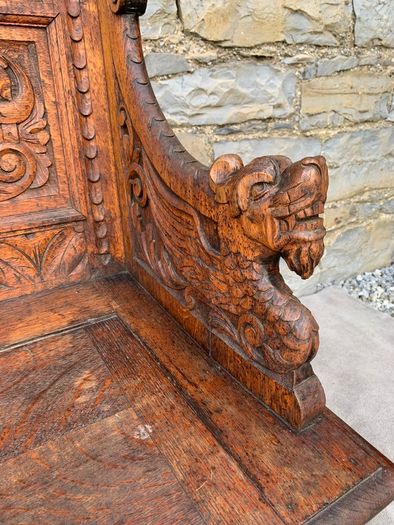 Late Victorian Gothic Revival Carved Oak Hall Settle.