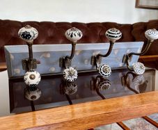 New Unused Stylish Entryway Mounted Ceramic and Brass Coat Hanger