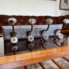 New Unused Stylish Entryway Mounted Ceramic and Brass Coat Hanger