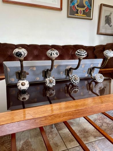New Unused Stylish Entryway Mounted Ceramic and Brass Coat Hanger