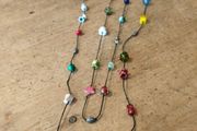 handmade funky necklace featuring a variety of colourful glass and stone beads