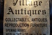 Antiques Advertising Sign