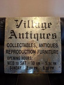 Antiques Advertising Sign