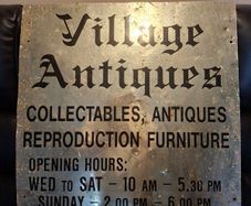 Antiques Advertising Sign