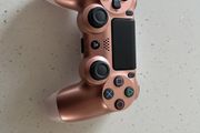 Rose gold ps4 controller ( mint condition and genuine )