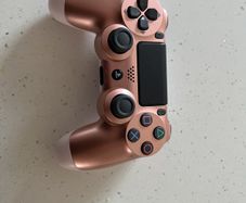 Rose gold ps4 controller ( mint condition and genuine )
