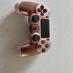 Rose gold ps4 controller ( mint condition and genuine )