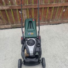 push petrol lawn mower with Briggs and Stratton engine very reliable starts easy runs perfect