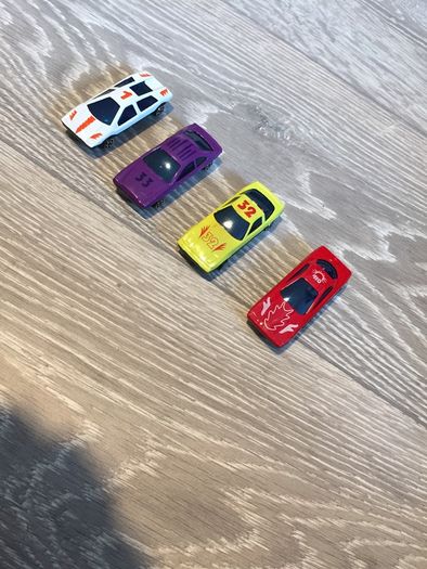 Four plastic Toy Cars