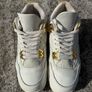 Air Jordan 4 White and Gold Trainers Image 2