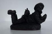 Genesis bronze boy reading with dog