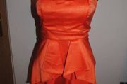 Orange sleeveless peplum dress size UK8/10 EU36/38 Postage included