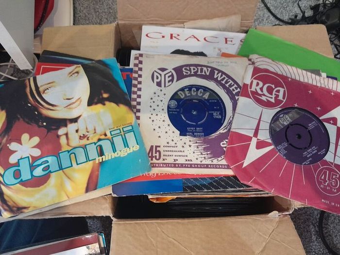 a box of 7" singles. 45 rpm vinyl records.