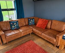 Tan leather corner sofa. Open to offers