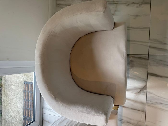 Cream and gold armchairs